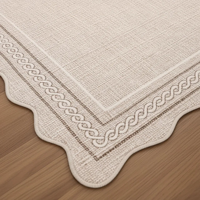 Tapis salon uni à bords festonnés